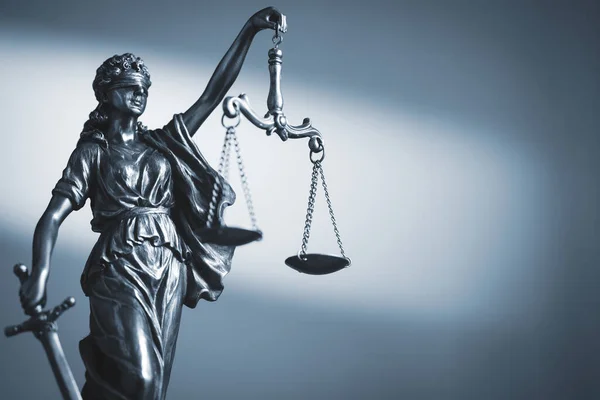 depositphotos_359657614-stock-photo-figure-of-justice-holding-scales