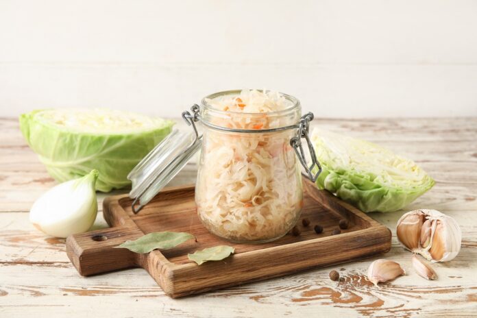 Jar,With,Homemade,Sauerkraut,On,Wooden,Tray,And,Ingredients,On