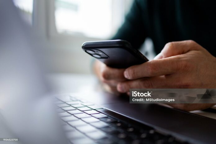 Focus on man hands typing message