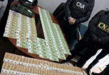 Patru persoane, reținute de CNA și procurori în flagrant pentru trafic de influență, după primirea unei mite de 40.000 de euro